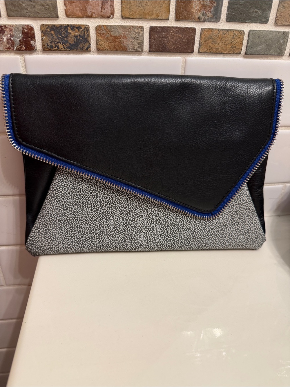 Halogen Black Clutch with Gray Pebbled Panel and Blue Trim
